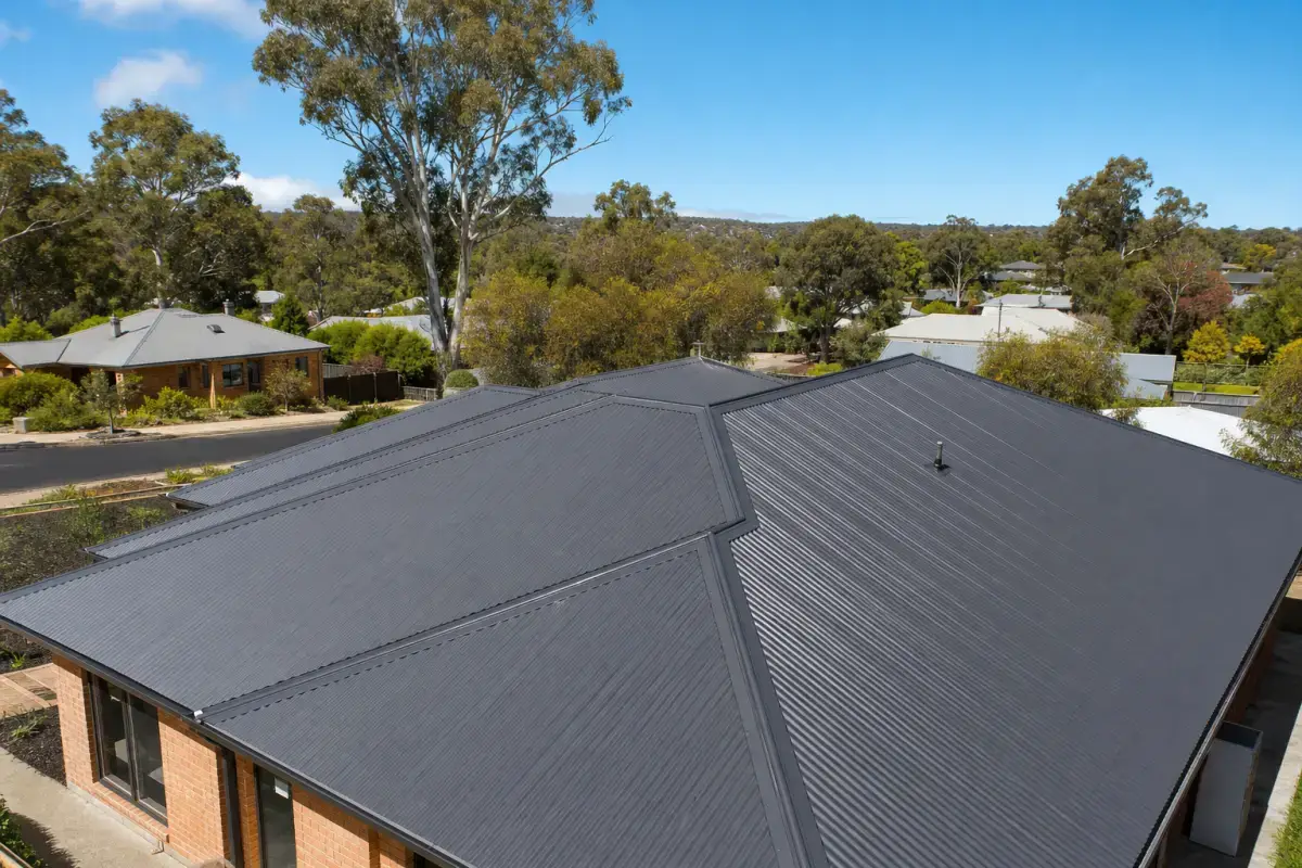 New charcoal Colorbond metal roof with crisp ridge and valley detailing, metal roofing in Bendigo