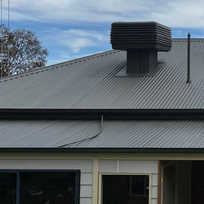 Grey corrugated metal roof with an evaporative cooler on a Bendigo home, recent client work