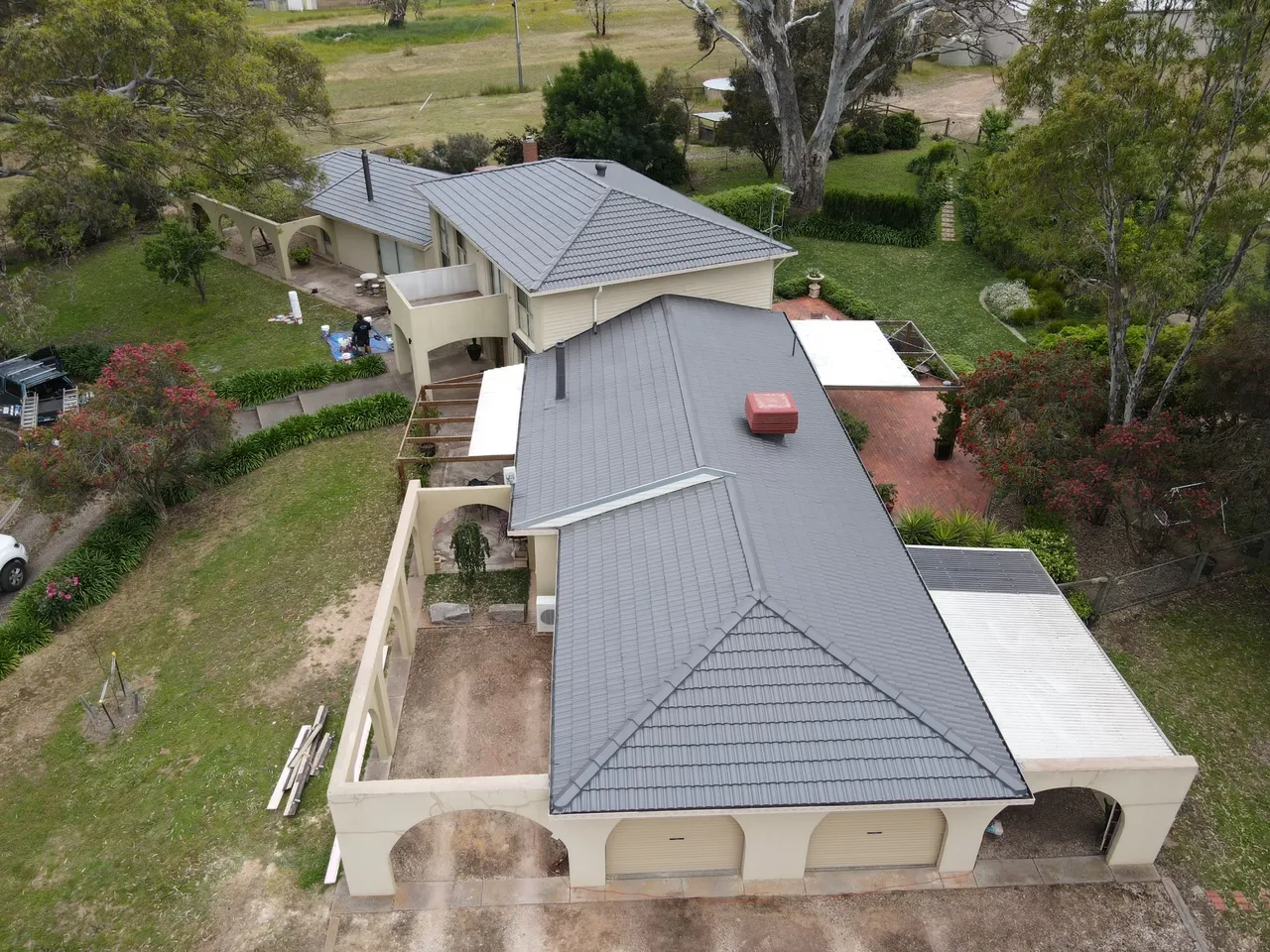 Concrete tile roof restored and recoated in charcoal grey across every hip and valley, a roof restoration by JTM Roof Restorations in the Bendigo region